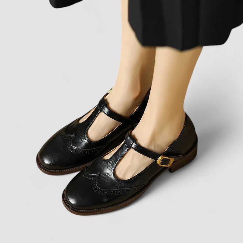 Women's Mary Jane shoes with buckle straps, perforated toe detailing and low block heels