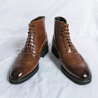 Men's ankle brogue boots with lace-up fronts, perforated detailing and low heels