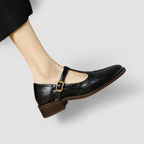 Women's Mary Jane shoes with buckle straps, perforated toe detailing and low block heels