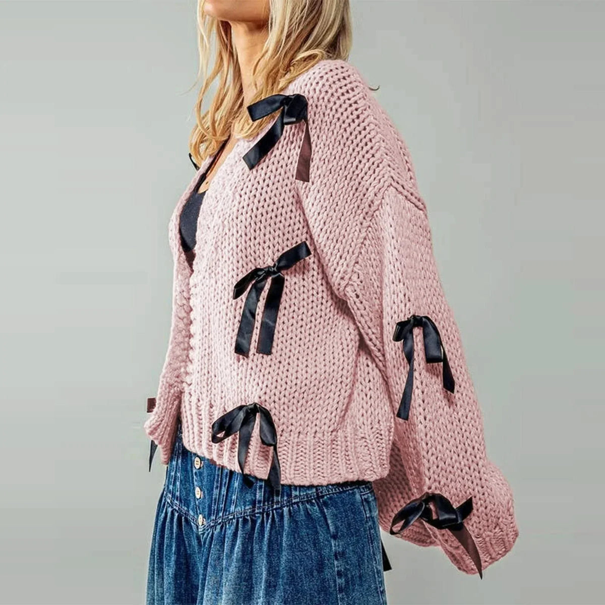 Women's chunky knit cardigan with contrasting bow ties and long sleeves