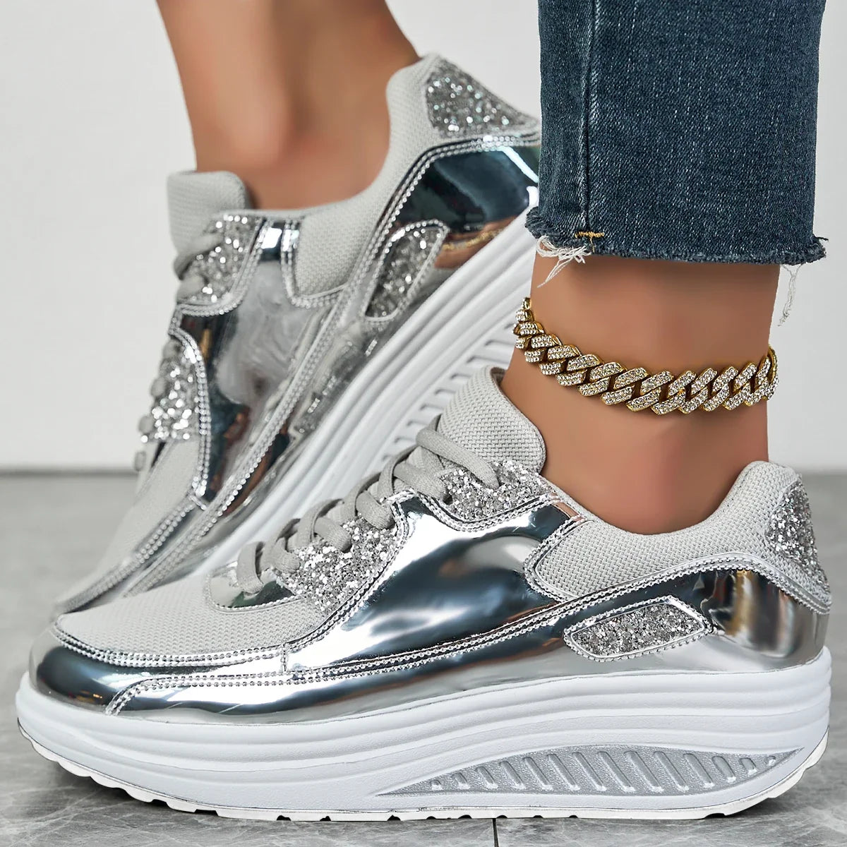 Women's embellished lace-up sneakers with metallic panels and layered platform soles