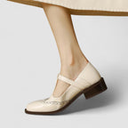 Women's Mary Jane shoes with buckle straps, perforated toe detailing and low block heels
