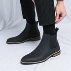 Men's Chelsea boots with elastic side panels, pull tabs and low heels