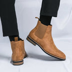 Men's Chelsea boots with elastic side panels, pull tabs and low heels