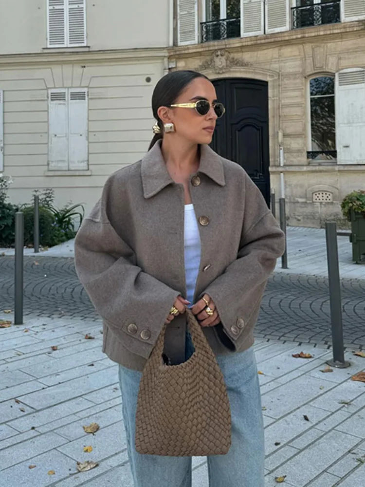Women's beige cropped jacket with spread collar and button fastening
