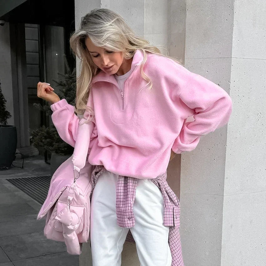 Women's pink fleece half-zip pullover with stand collar and long sleeves