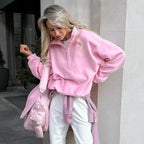 Women's pink fleece half-zip pullover with stand collar and long sleeves