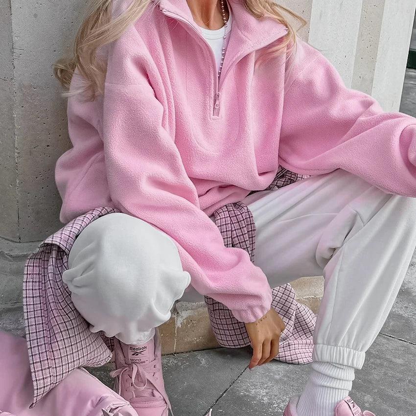 Women's pink fleece half-zip pullover with stand collar and long sleeves