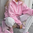 Women's pink fleece half-zip pullover with stand collar and long sleeves