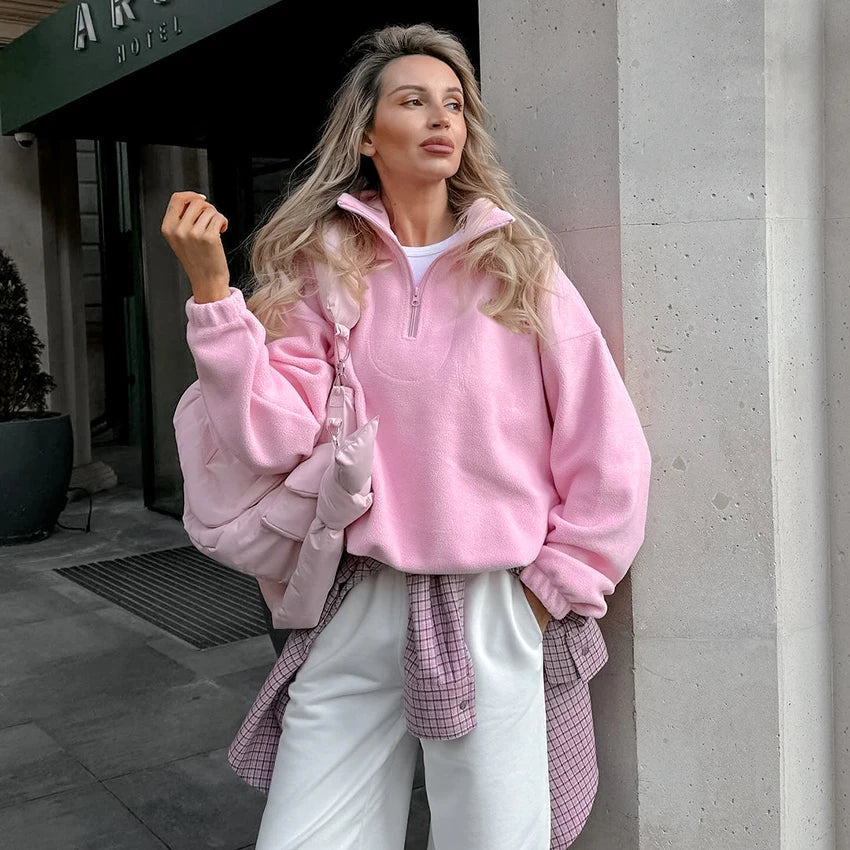 Women's pink fleece half-zip pullover with stand collar and long sleeves