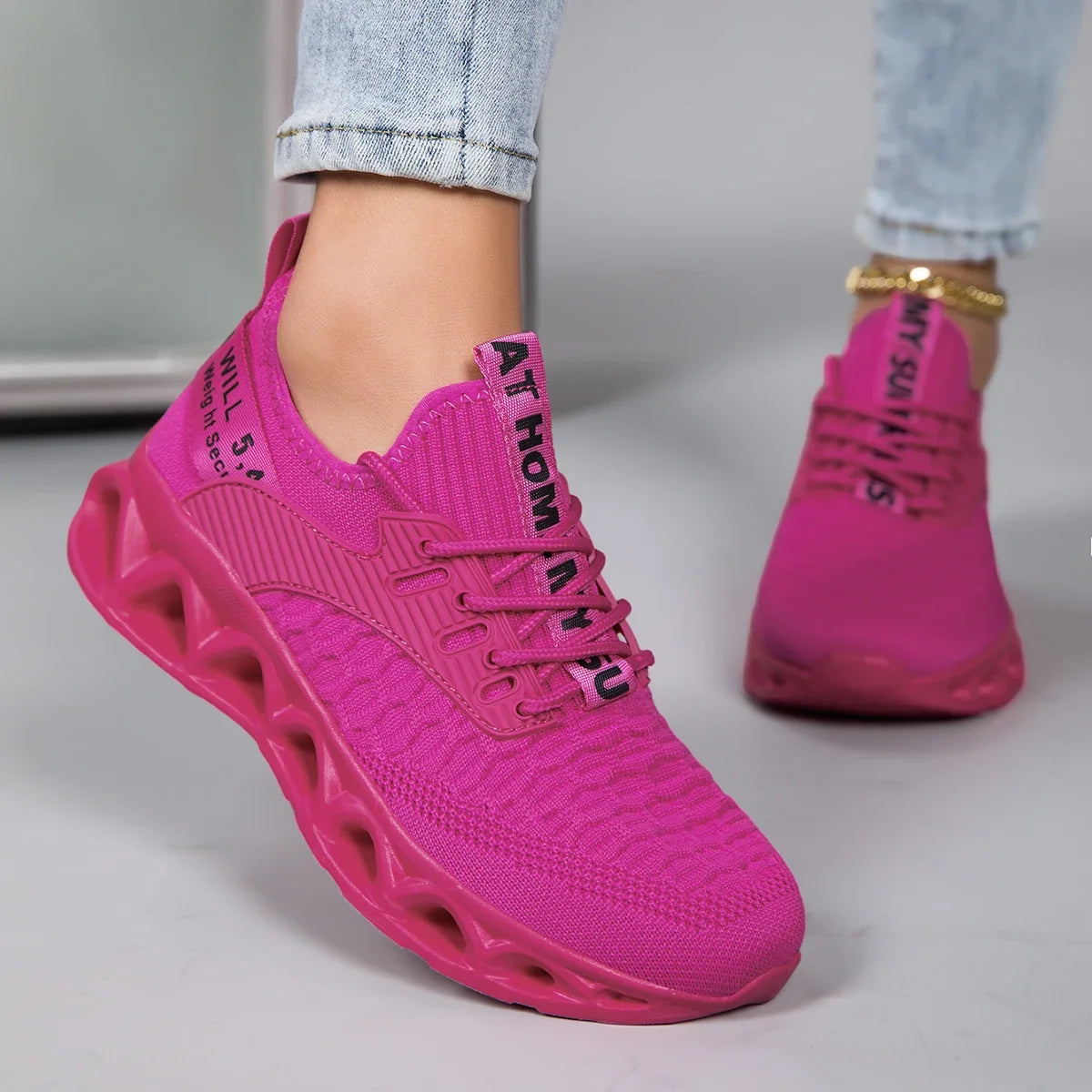 Women's lace-up trainers with textured upper and sculpted flat sole