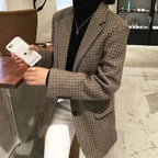 Women's brown checked blazer with notched lapels, long sleeves and button fastening