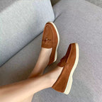 Women's slip-on loafers with penny strap and flat sole