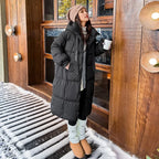 Women's long hooded quilted puffer coat with oversized fit and zip front