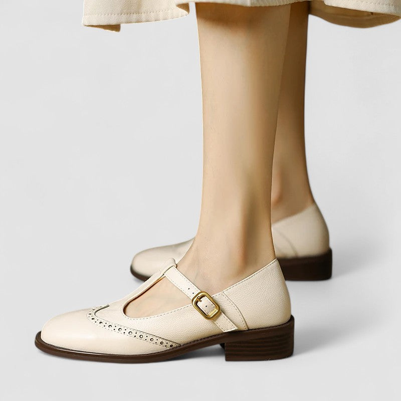 Women's Mary Jane shoes with buckle straps, perforated toe detailing and low block heels