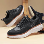 Textured lace-up trainers with round toe and layered flat sole