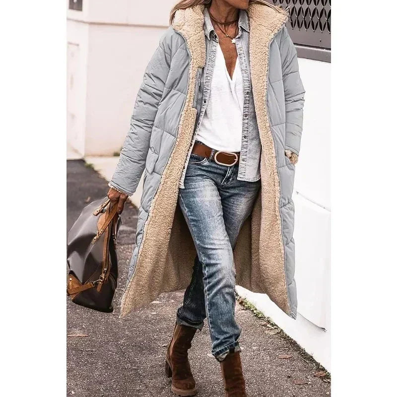 Women's long quilted hooded coat with contrasting textured trim and side pockets