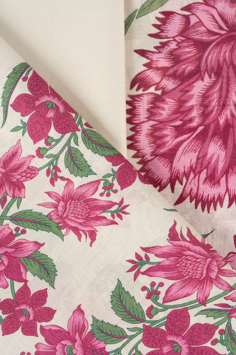 Pink and off-white floral printed fabric for a shirt, trouser and dupatta set