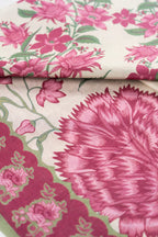 Pink and off-white floral printed fabric for a shirt, trouser and dupatta set