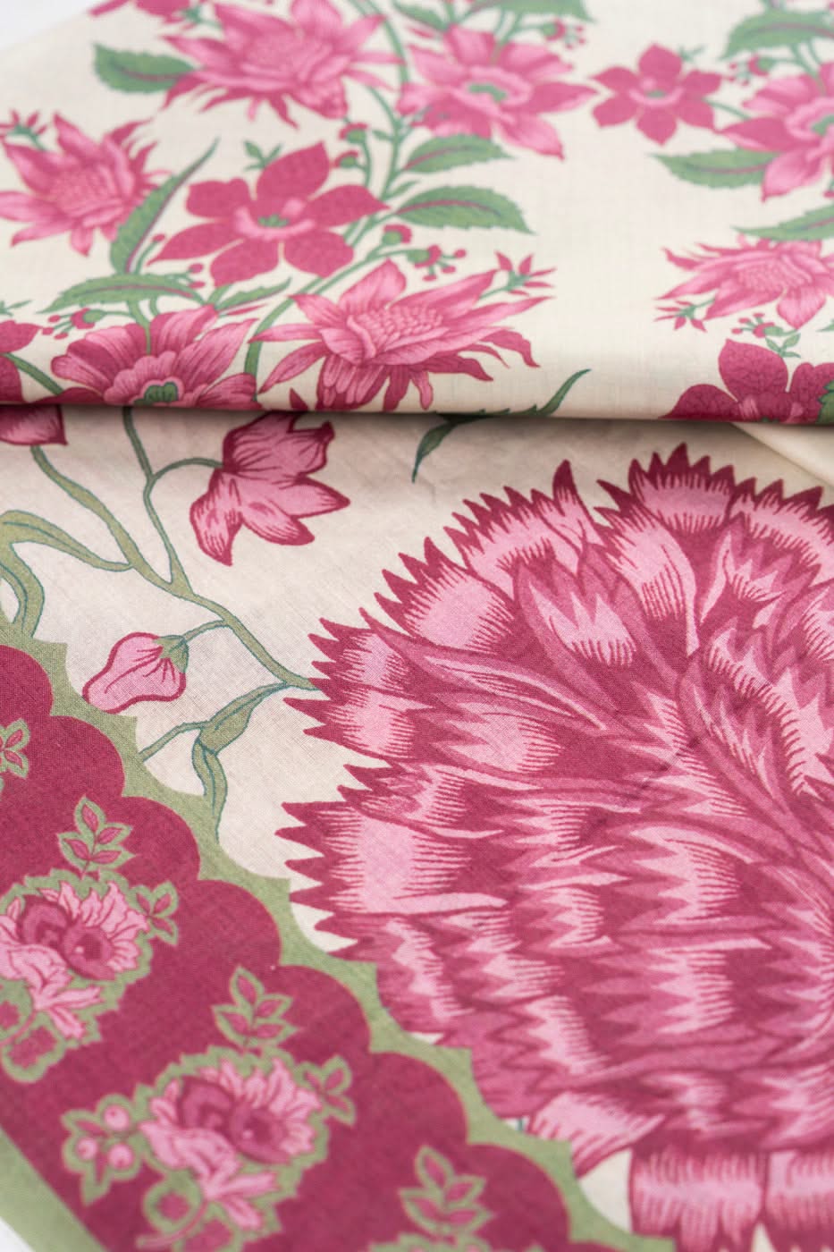 Pink and off-white floral printed fabric for a shirt, trouser and dupatta set