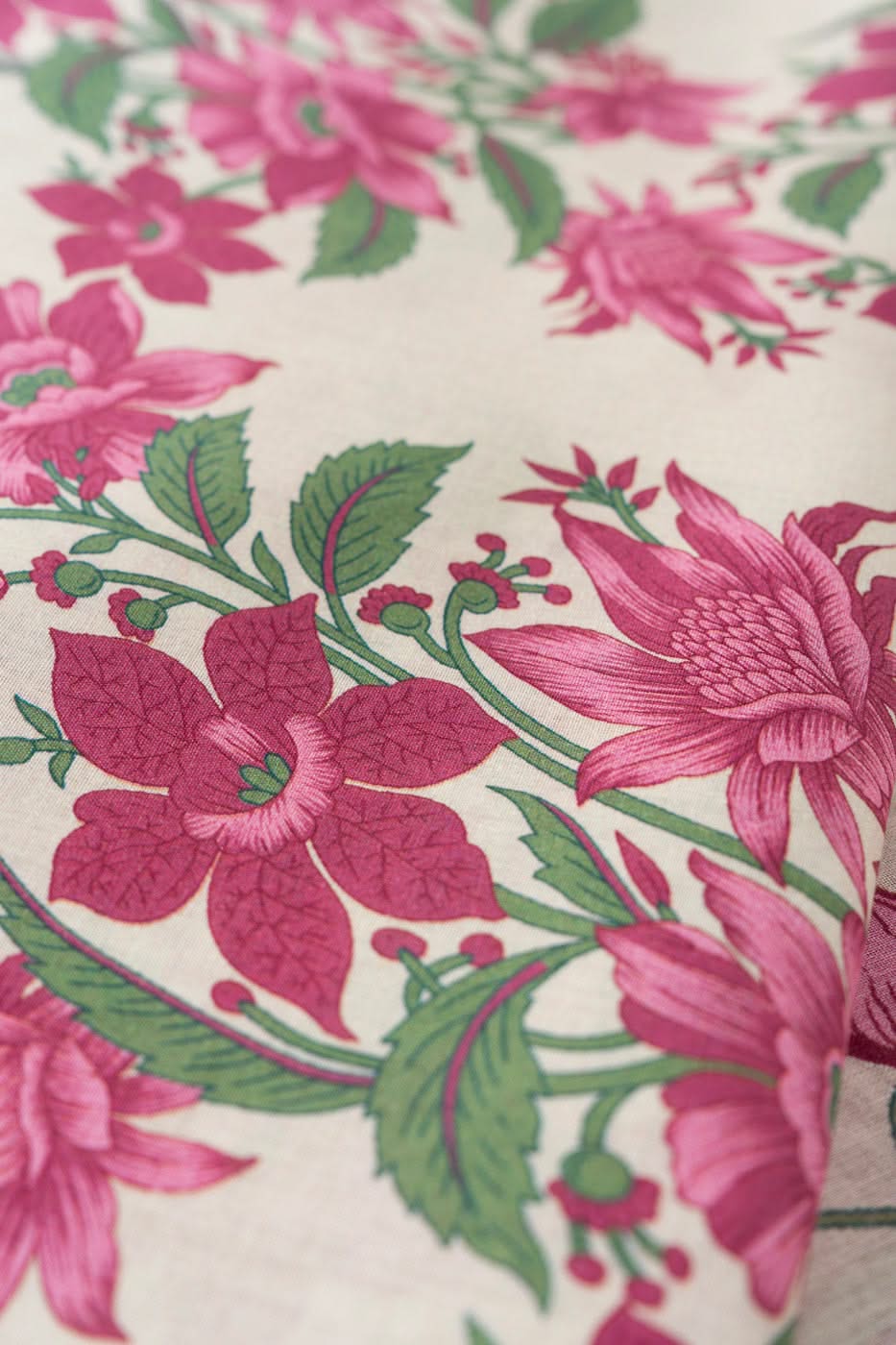 Pink and off-white floral printed fabric for a shirt, trouser and dupatta set