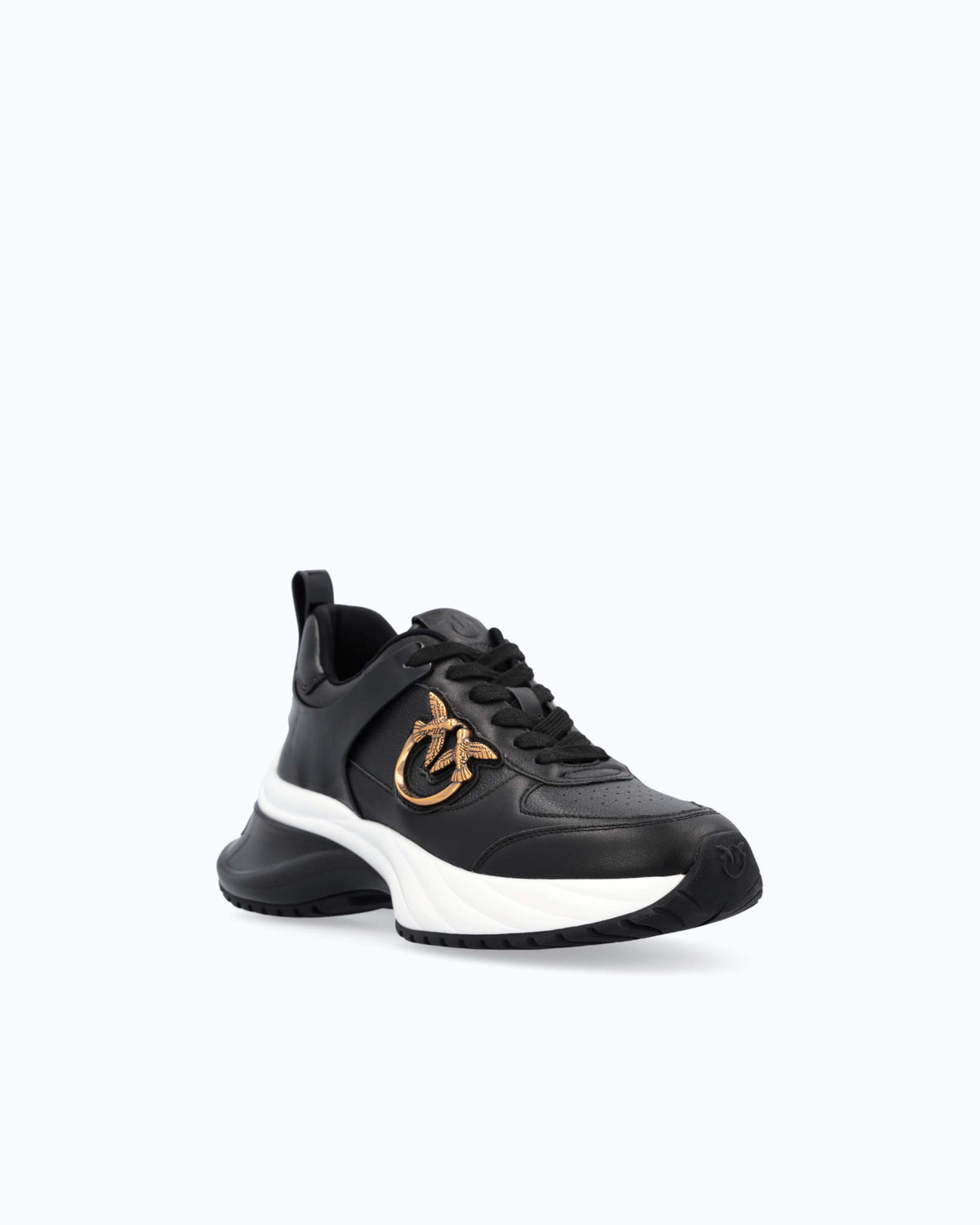 Black lace-up platform trainers with white sole and gold side emblem