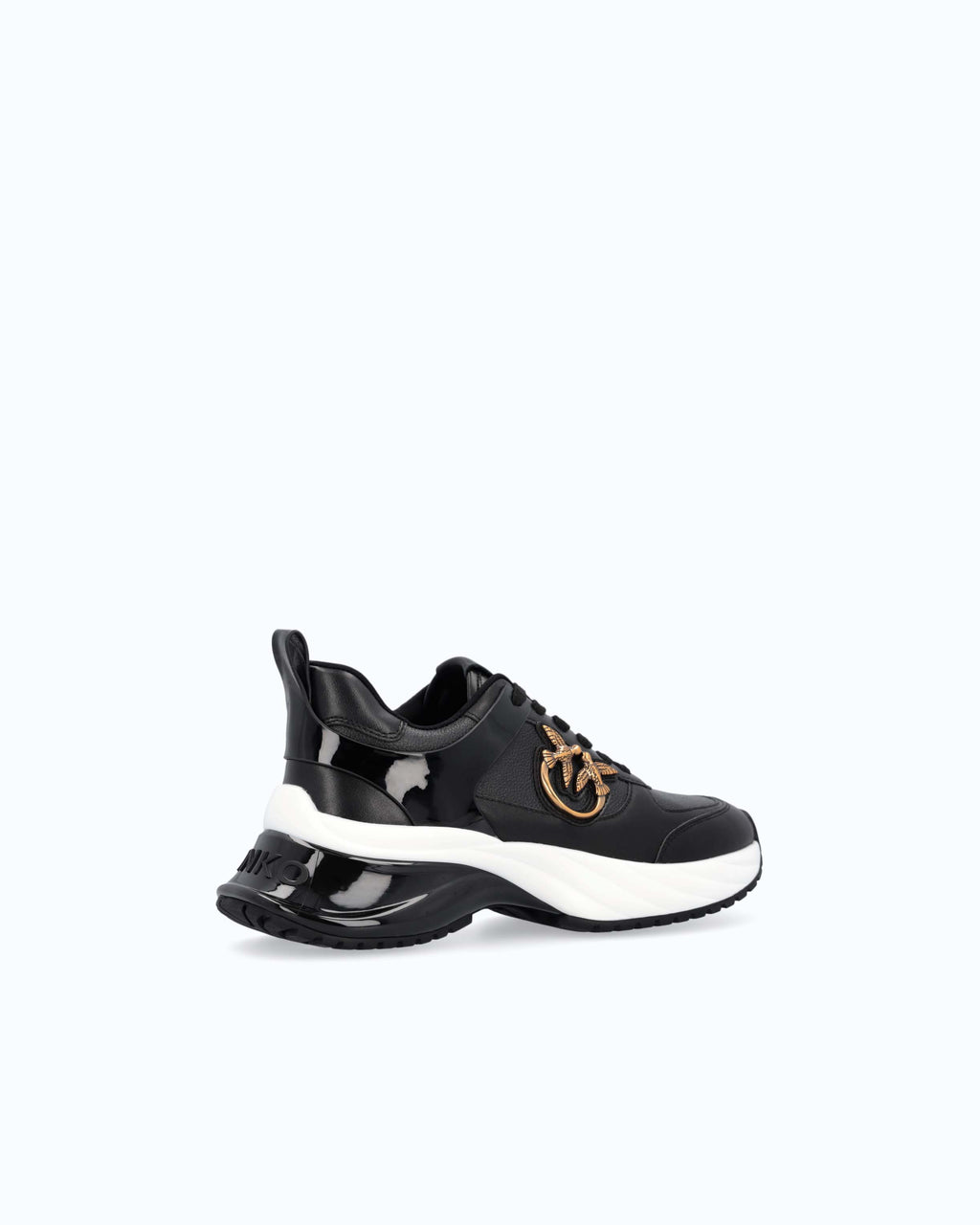 Black lace-up platform trainers with white sole and gold side emblem