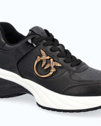 Black lace-up platform trainers with white sole and gold side emblem