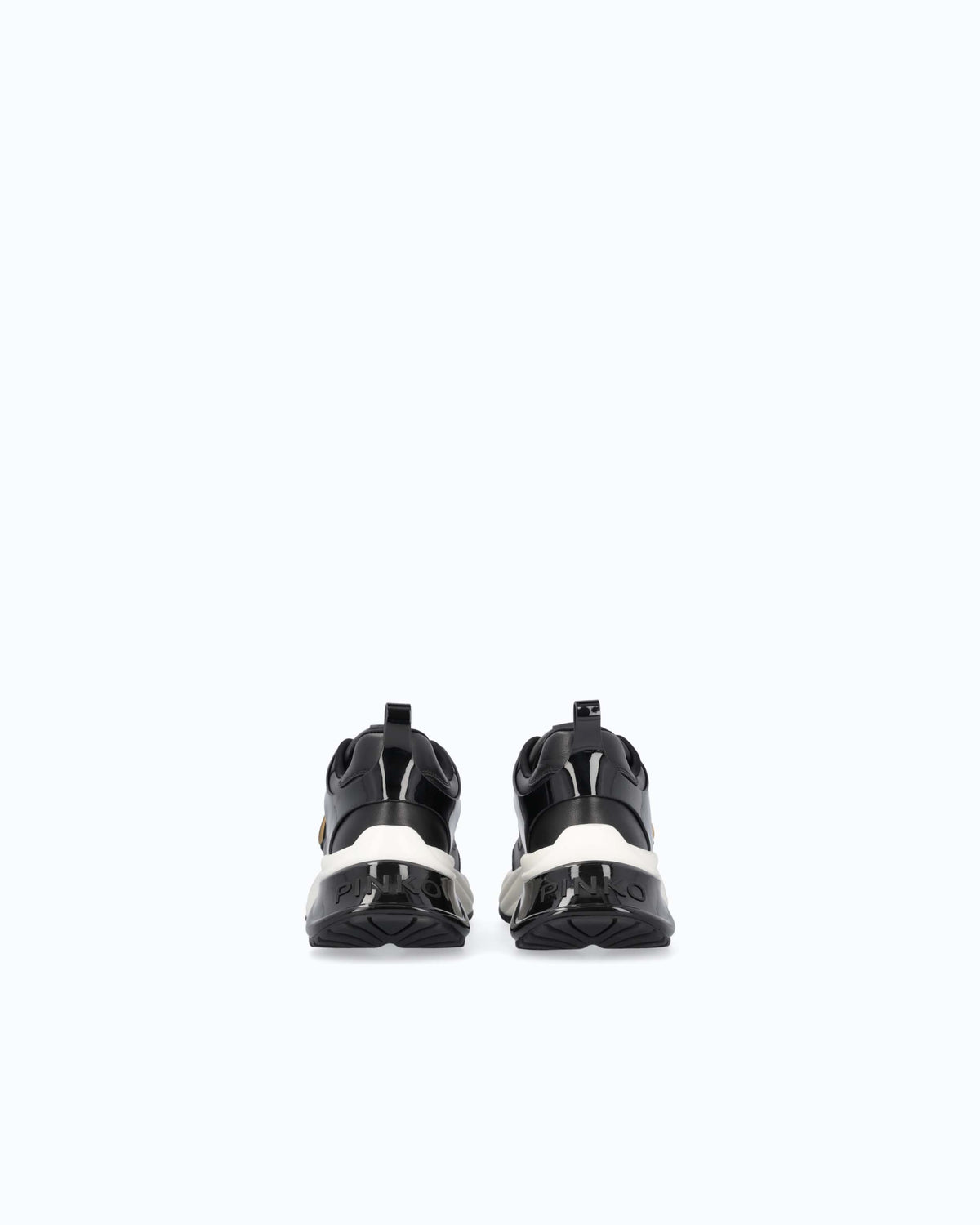 Black lace-up platform trainers with white sole and gold side emblem