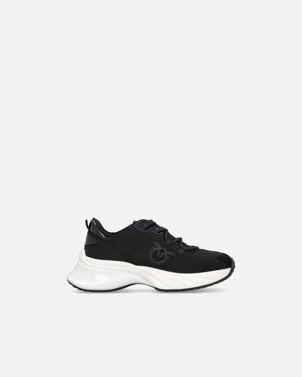 Black perforated trainers with lace-up fastening and white chunky sole