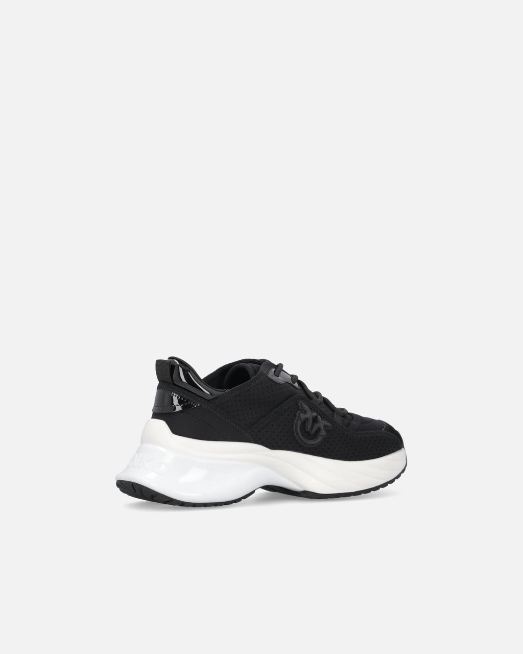 Black perforated trainers with lace-up fastening and white chunky sole
