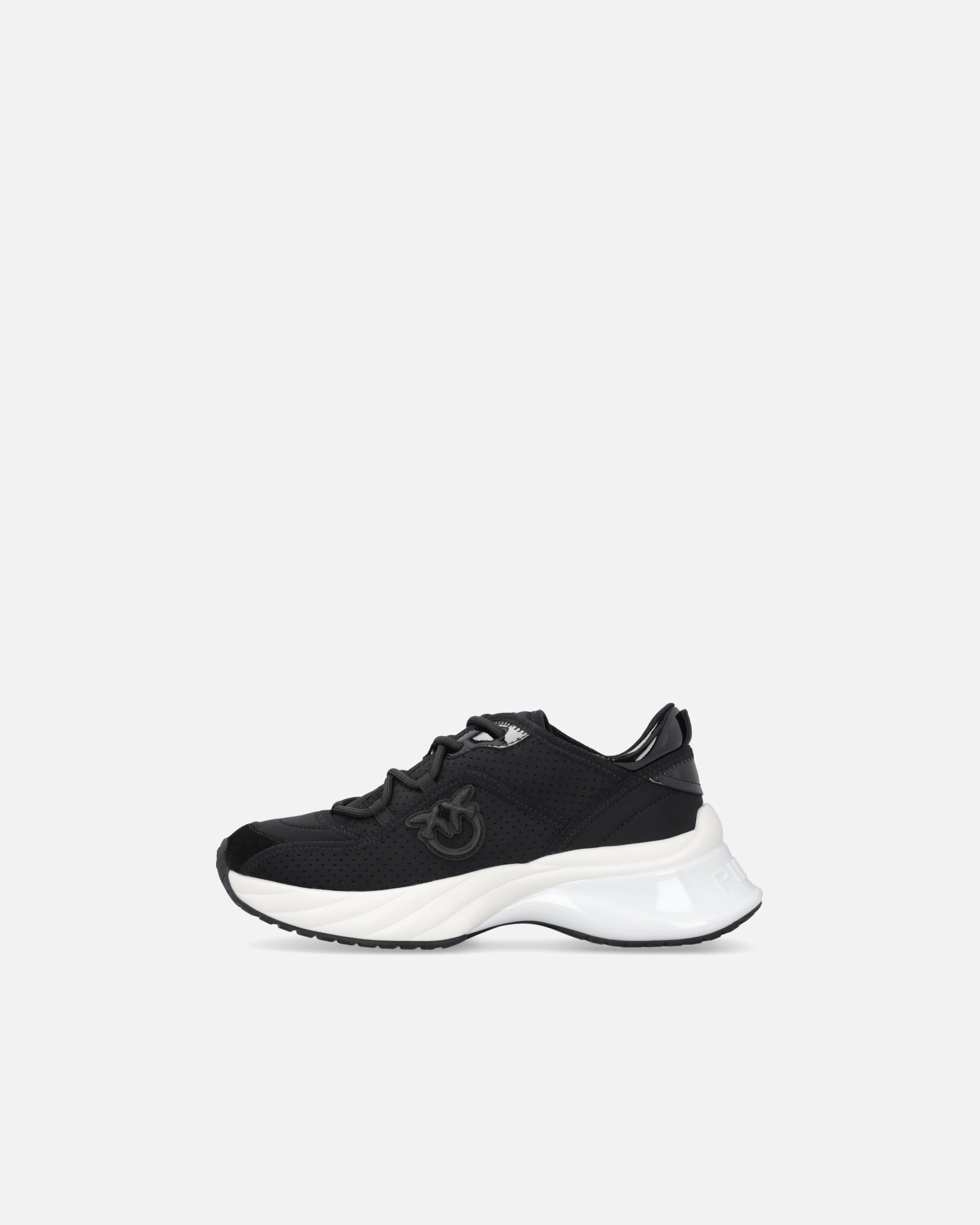 Black perforated trainers with lace-up fastening and white chunky sole