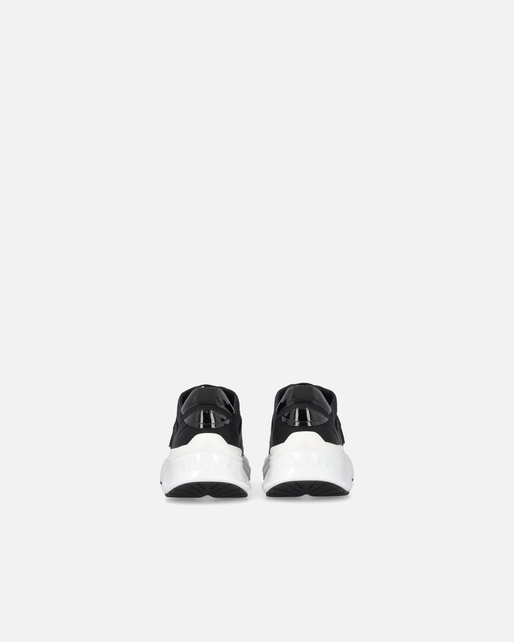 Black perforated trainers with lace-up fastening and white chunky sole