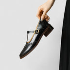 Women's Mary Jane shoes with buckle straps, perforated toe detailing and low block heels