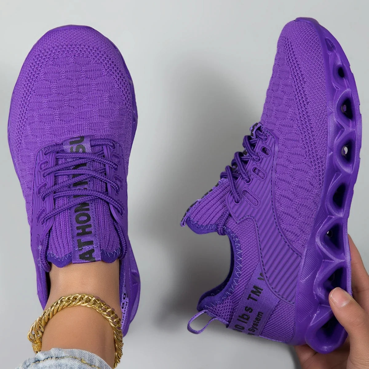 Women's lace-up trainers with textured upper and sculpted flat sole