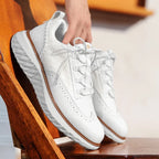 Textured lace-up trainers with round toe and layered flat sole