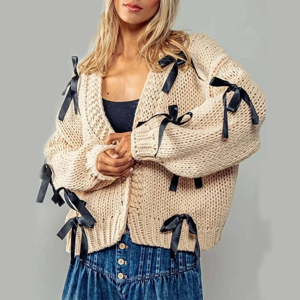 Women's chunky knit cardigan with contrasting bow ties and long sleeves