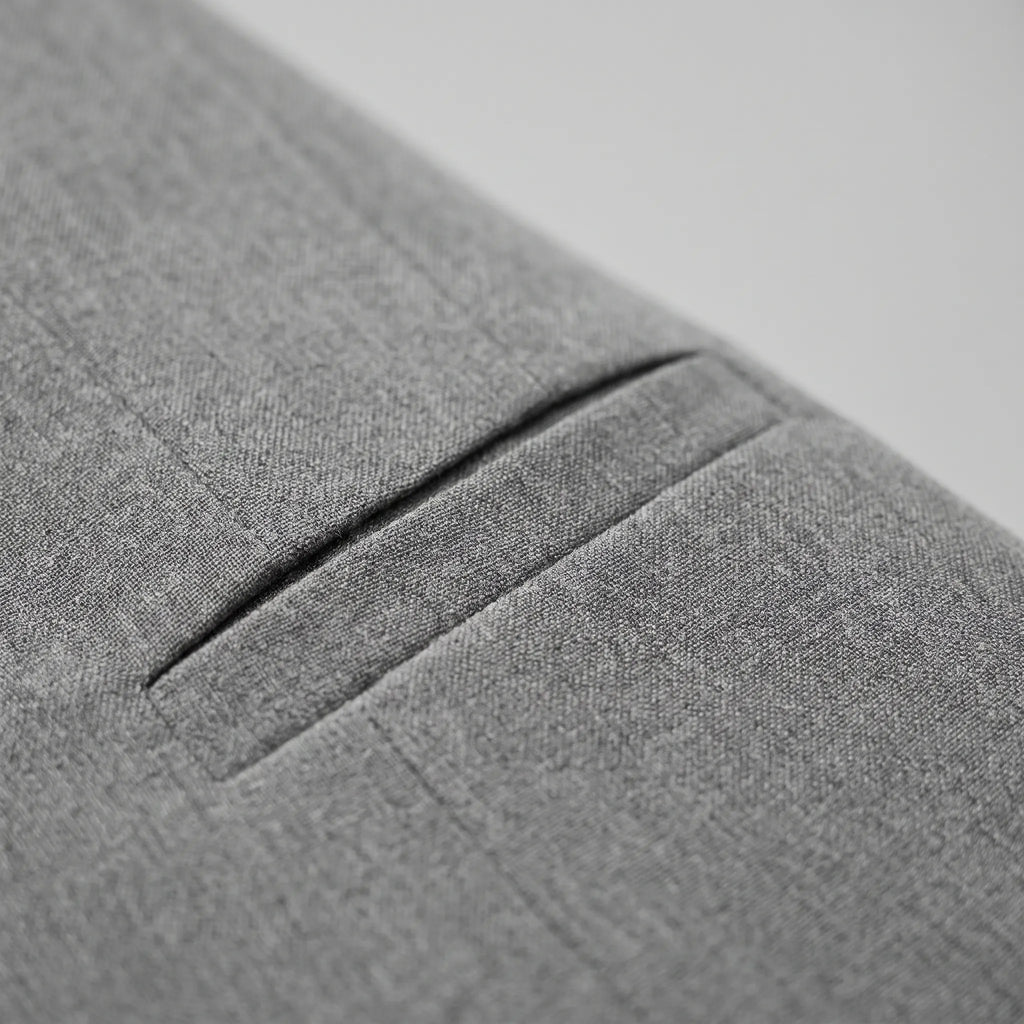 Women's grey collarless cropped blazer with long sleeves and silver-toned buttons