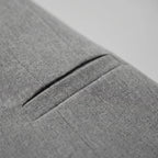Women's grey collarless cropped blazer with long sleeves and silver-toned buttons