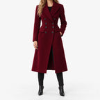 Women's burgundy double-breasted tailored long coat with notch lapels and flap pockets
