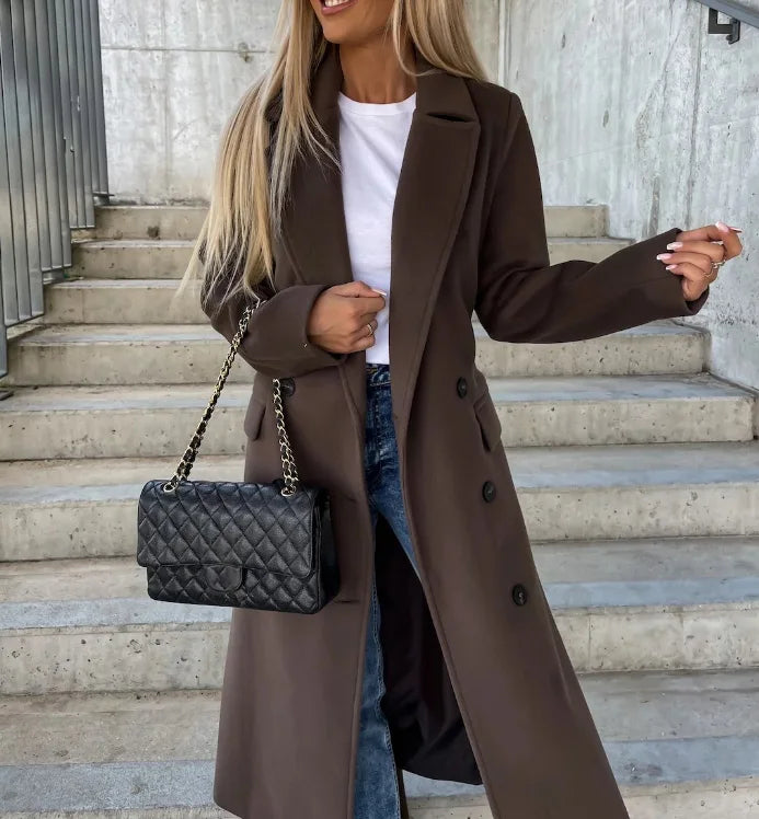 Women's long belted double-breasted coat with notched lapels and flap pockets