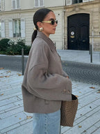 Women's beige cropped jacket with spread collar and button fastening