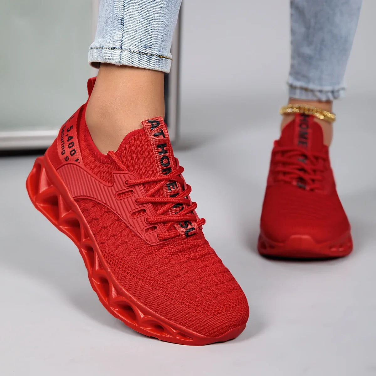 Women's lace-up trainers with textured upper and sculpted flat sole