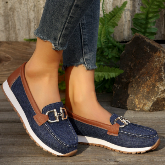Women's flat slip-on loafers with buckle trims and moc-toe stitching