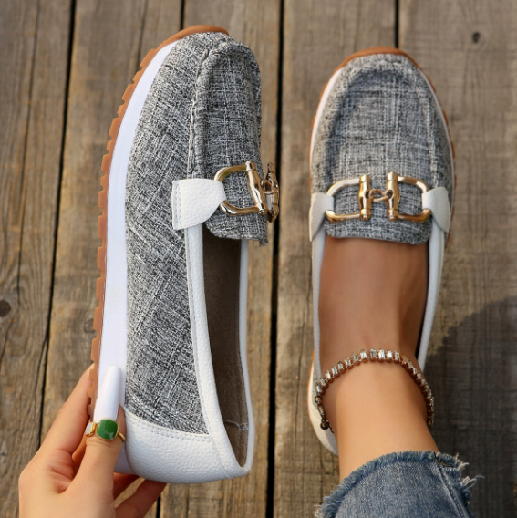 Women's flat slip-on loafers with buckle trims and moc-toe stitching