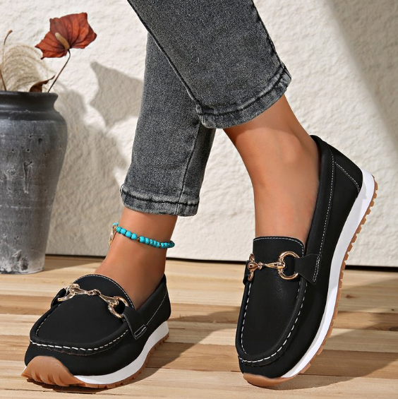 Women's flat loafers with moc toe, metal buckle trim and textured soles