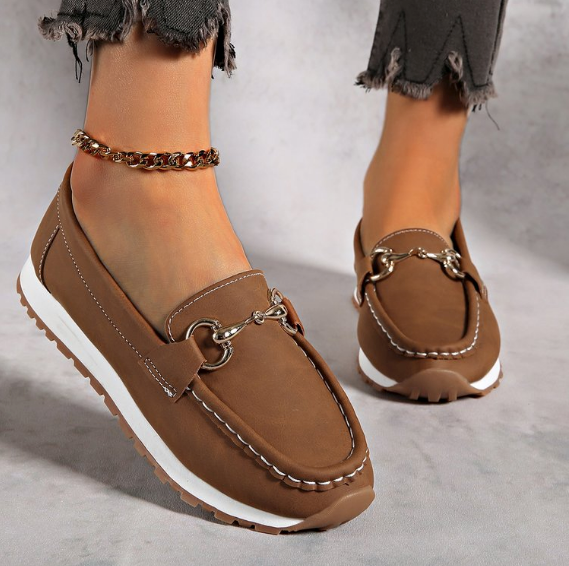 Women's flat loafers with moc toe, metal buckle trim and textured soles