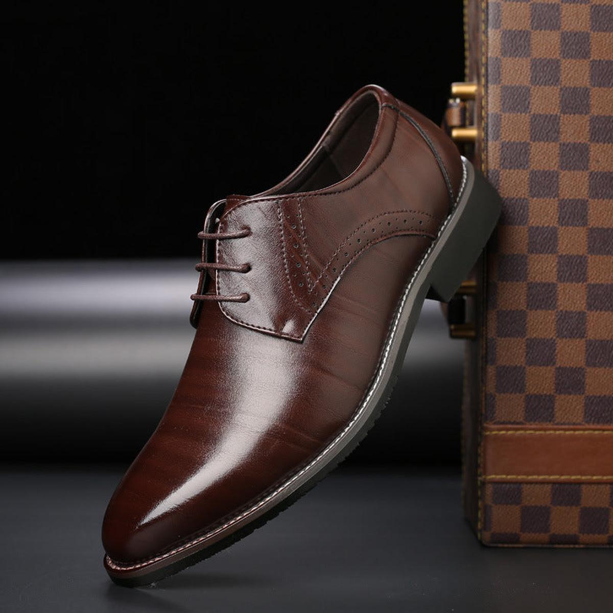 Men's pointed toe lace-up dress shoes with a polished finish and low heel