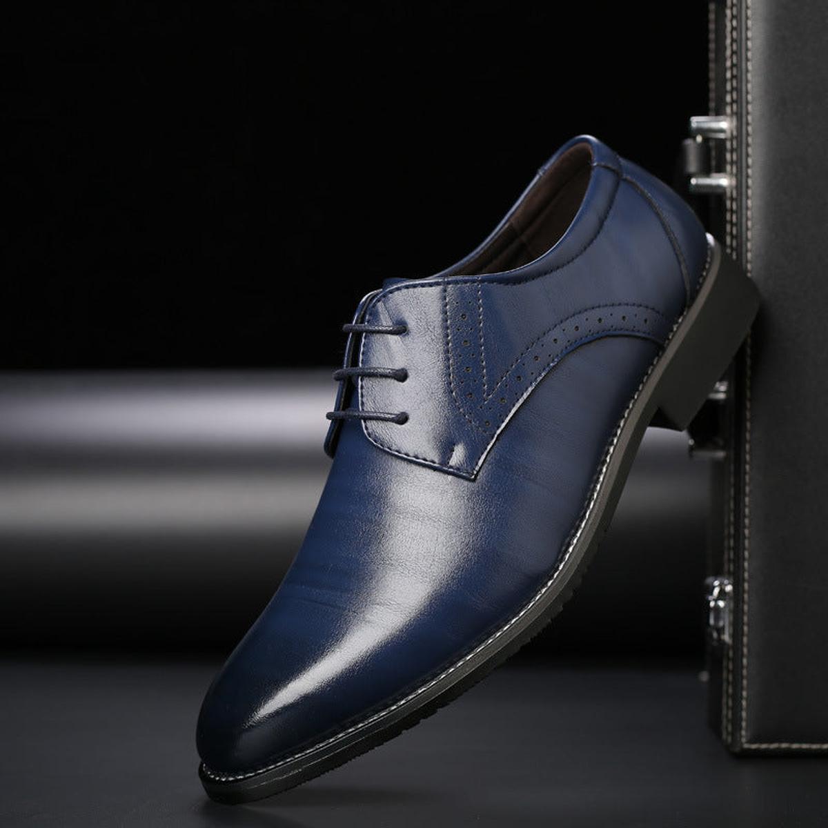 Men's pointed toe lace-up dress shoes with a polished finish and low heel