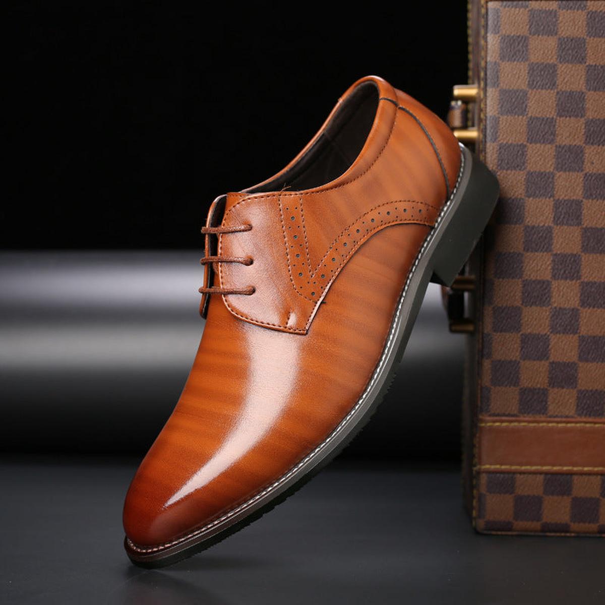 Men's pointed toe lace-up dress shoes with a polished finish and low heel